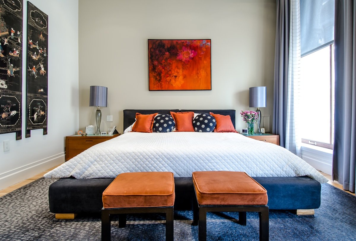 Bedroom layout showing feng shui bed facing door risk — bed directly aligned with door creates rushing qi path